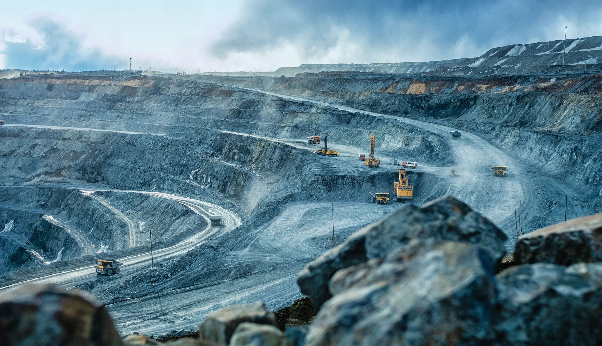 An open-pit mine with haul trucks