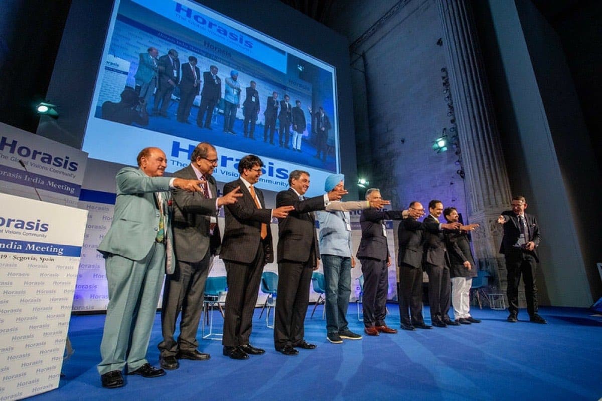 Speakers on stage at a Horasis meeting